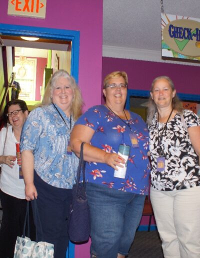 5 women entering a banquet hall