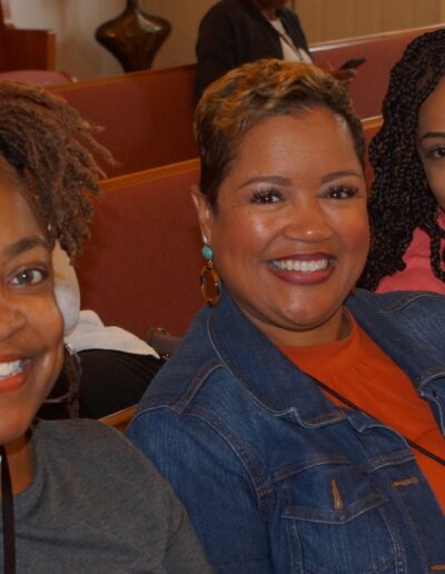 three women attending a meeting