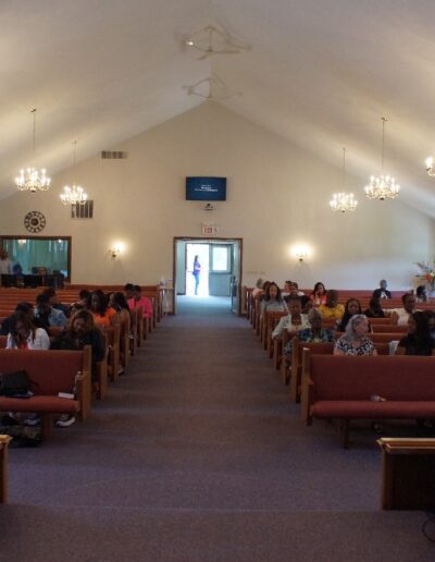 meeting attendees in a chapel